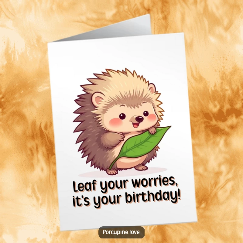 Funny Free Printable Birthday Card: Fluffy porcupine with quills concentrating intensely, trying to balance a single fallen leaf.