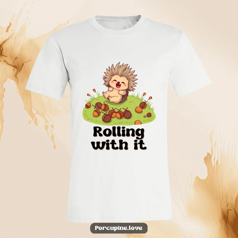 Funny T-Shirt: A cute porcupine character joyfully rolls down a grassy hill, surrounded by scattered acorns.